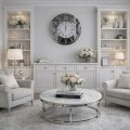 Zegar ścienny glamour lustrzany z kryształkami – aranżacja z białym regałem i szarymi fotelami.jpg