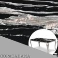 Próbka kwarcu Copacabana – czarny kamień z poziomymi biało-szarymi pasami.jpg